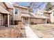Inviting multi-level home featuring neutral siding and an appealing entryway at 13304 E Asbury Dr, Aurora, CO 80014