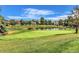 Scenic view of the golf course, pond, and lush greenery surrounding the community homes at 13304 E Asbury Dr, Aurora, CO 80014