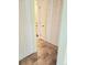 Hallway with multiple closets and a glimpse into a bathroom at 13304 E Asbury Dr, Aurora, CO 80014