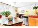 The open concept kitchen with stainless appliances is adjacent to a cozy living space at 13304 E Asbury Dr, Aurora, CO 80014