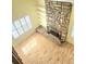 Bright living room features a stone fireplace, built-in shelving, and hardwood floors at 13304 E Asbury Dr, Aurora, CO 80014