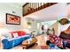 Bright living room features a loft, hardwood floors, and cozy seating at 13304 E Asbury Dr, Aurora, CO 80014