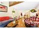 Inviting living room with hardwood floors, comfortable seating, and a loft at 13304 E Asbury Dr, Aurora, CO 80014