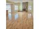 Open living room features a stone fireplace, built-in shelving, and hardwood floors at 13304 E Asbury Dr, Aurora, CO 80014