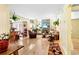 Bright living room with hardwood floors, a stone fireplace, and large windows at 13304 E Asbury Dr, Aurora, CO 80014