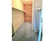 Spacious walk-in closet with ample storage, shelving, and cedar plank accent wall for optimal organization at 13304 E Asbury Dr, Aurora, CO 80014