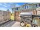 Private patio with a fenced yard and a Traeger grill, perfect for outdoor cooking and entertaining at 9023 Apache Plume Dr # C, Parker, CO 80134