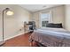 Simple bedroom design with a computer desk, a cozy bed, and a window with natural light at 9023 Apache Plume Dr # C, Parker, CO 80134