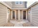 Townhome entrance featuring dual front doors, rock landscaping, and modern fixtures at 9023 Apache Plume Dr # C, Parker, CO 80134