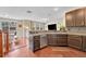 Stylish kitchen seamlessly connects with the living area, featuring stainless steel appliances and dark cabinets at 9023 Apache Plume Dr # C, Parker, CO 80134