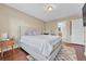 Spacious main bedroom with a king-size bed and access to the en-suite bathroom at 9023 Apache Plume Dr # C, Parker, CO 80134