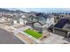An aerial view of a charming neighborhood featuring a two-story home with solar panels, well-manicured lawns at 18541 W 93Rd Pl, Arvada, CO 80007