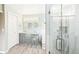 Modern bathroom showcasing double sinks, a shower, and stylish fixtures, creating a luxurious space at 76 Buckthorn Dr, Littleton, CO 80127