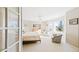 Bright, spacious bedroom with a view from the window, neutral carpet, and a ceiling fan at 76 Buckthorn Dr, Littleton, CO 80127