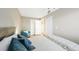 Bright bedroom with neutral walls, comfortable bed, a ceiling fan, and a bright window at 76 Buckthorn Dr, Littleton, CO 80127