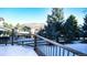 Deck overlooking backyard, snow and mountain views at 76 Buckthorn Dr, Littleton, CO 80127