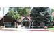 Exterior view of The Ranch House featuring warm wood tones, inviting architecture, and well-maintained landscaping at 76 Buckthorn Dr, Littleton, CO 80127