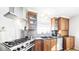 Kitchen with stainless steel appliances and wood cabinets at 76 Buckthorn Dr, Littleton, CO 80127