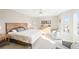 Bright main bedroom features neutral walls, comfortable furniture and natural light at 76 Buckthorn Dr, Littleton, CO 80127