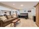 Finished basement featuring a pool table, a large leather sofa and carpeted floors at 5 Cliffrose, Littleton, CO 80127