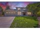 Charming two-story home featuring a well-manicured lawn, a two-car garage, and inviting curb appeal at 5 Cliffrose, Littleton, CO 80127