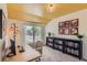 Bright office space with a large window, desk, and bookshelves, perfect for working from home at 5 Cliffrose, Littleton, CO 80127