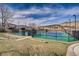 Scenic view of well-maintained tennis courts with mountain backdrop at 5 Cliffrose, Littleton, CO 80127