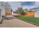 Spacious backyard featuring a lush lawn and convenient shed for extra storage at 2888 S Fundy St, Aurora, CO 80013