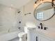 Modern bathroom with a marble tiled shower, and stylish black hardware at 2888 S Fundy St, Aurora, CO 80013