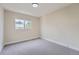 Comfortable bedroom with a large window and carpeted floor at 2888 S Fundy St, Aurora, CO 80013