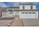 Charming two-story home with a front porch, garage and landscaped front yard at 2888 S Fundy St, Aurora, CO 80013