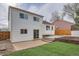 Home's exterior shows a well-maintained yard and a back entrance, providing access to outdoor spaces at 2888 S Fundy St, Aurora, CO 80013