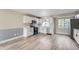 Spacious kitchen with modern appliances, white cabinets, and ample counter space at 2888 S Fundy St, Aurora, CO 80013