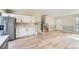 Open concept kitchen with stainless steel appliances, staircase and access to the living room at 2888 S Fundy St, Aurora, CO 80013