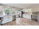 Modern kitchen with stainless steel appliances, white cabinetry and plenty of light at 2888 S Fundy St, Aurora, CO 80013