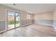 Living Room with sliding glass doors providing access to the patio and backyard at 2888 S Fundy St, Aurora, CO 80013