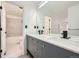 Modern bathroom features a double vanity with sleek fixtures and a bathtub with tiled surround at 2685 S Dayton Way # 67, Denver, CO 80231