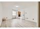 Bright bedroom with wood flooring, a large window, and access to the bathroom and living room at 2685 S Dayton Way # 67, Denver, CO 80231