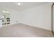 Spacious bedroom featuring neutral carpet, an ensuite bathroom, and a large closet at 2685 S Dayton Way # 67, Denver, CO 80231