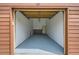 Spacious garage with painted floor and walls, offering ample storage and parking at 2685 S Dayton Way # 67, Denver, CO 80231