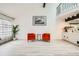Bright living room with hardwood floors and plant next to the window at 2685 S Dayton Way # 67, Denver, CO 80231
