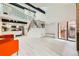 Bright living room with hardwood floors, high ceilings, and an open floor plan to the modern kitchen at 2685 S Dayton Way # 67, Denver, CO 80231