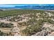 Aerial shot of a charming neighborhood, showcasing its layout and tree coverage with mountains in the background at 1766 Summerglow Ln, Monument, CO 80132