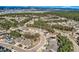Aerial view of the community showcasing tree coverage, beautiful landscaping and mountainous views at 1766 Summerglow Ln, Monument, CO 80132