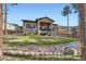 Expansive backyard featuring lush green grass and beautiful landscaping at 1766 Summerglow Ln, Monument, CO 80132