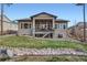 Backyard view showcasing the outdoor patio and meticulously kept lawn at 1766 Summerglow Ln, Monument, CO 80132