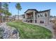 Large backyard with a manicured lawn and rock landscaping at 1766 Summerglow Ln, Monument, CO 80132