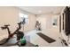 Basement gym complete with Peloton, yoga mat, and inversion table for a healthy lifestyle at 1766 Summerglow Ln, Monument, CO 80132