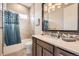 Cozy bathroom with warm lighting, a bathtub, and a decorative vanity at 1766 Summerglow Ln, Monument, CO 80132