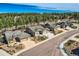 Attractive exterior elevation with a well-maintained lawn, three car garages, and mature landscaping at 1766 Summerglow Ln, Monument, CO 80132